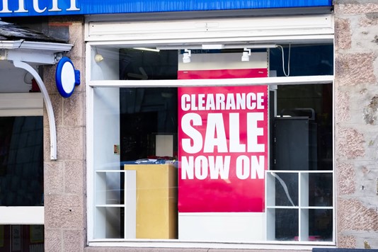 Clearance sale sign in store window