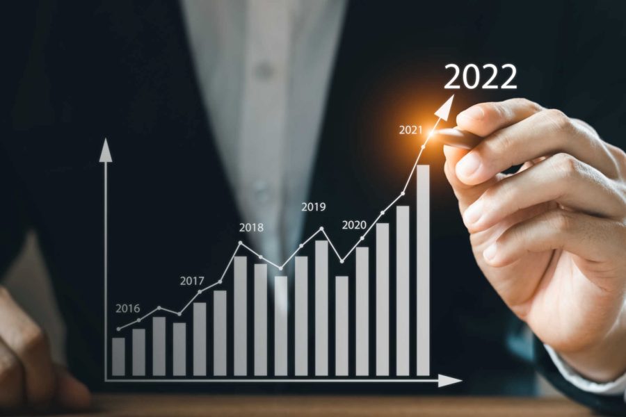 Businessman tracking business growth into 2022