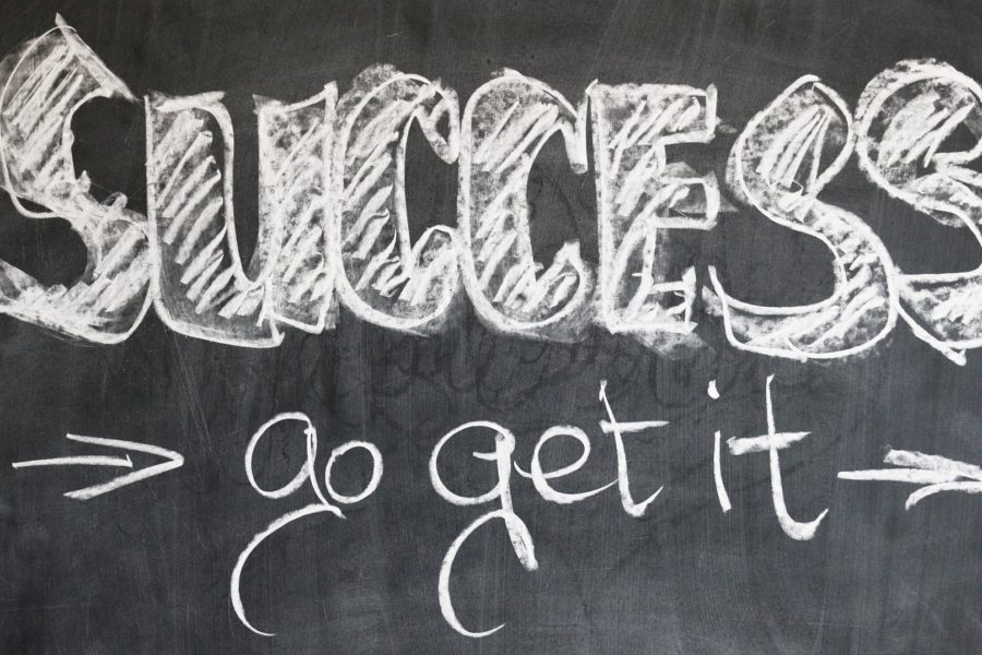 The words “Success – Go get it” written on a chalk board