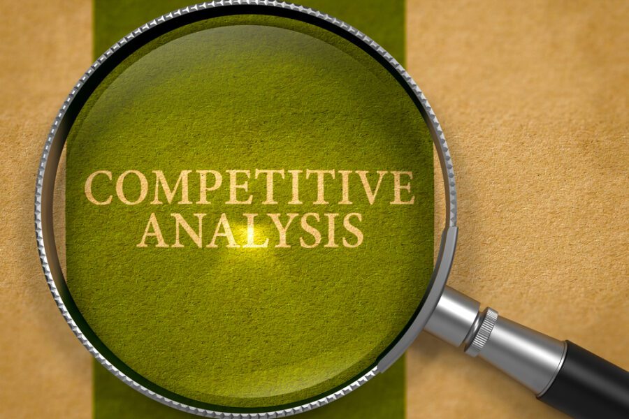 Competitive Analysis through Loupe on Old Paper with Dark Green Vertical Line Background.